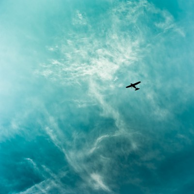 Plane - Sky - Clouds